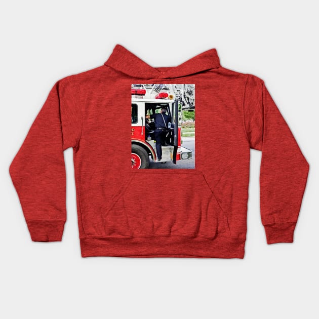 Firemen - Climbing into the Fire Truck Kids Hoodie by SusanSavad